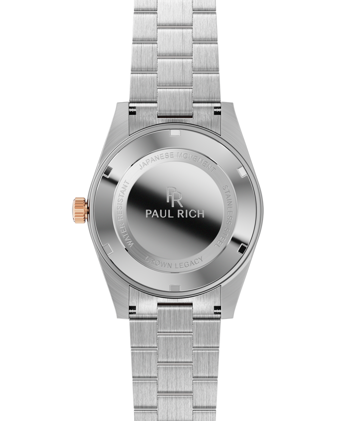Stainless-steel watch case back with engraved text and logo, brushed metal bracelet links, and a rose-gold crown.