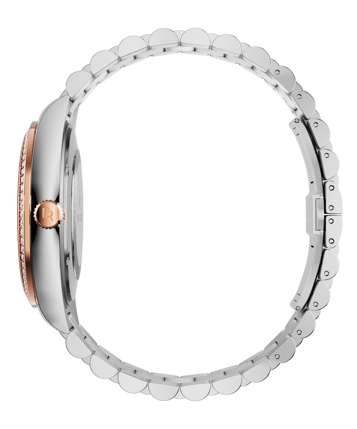 Side view of a silver watch with a rose-gold crown and gem-set bezel, showing the slim case profile and full stainless-steel bracelet.