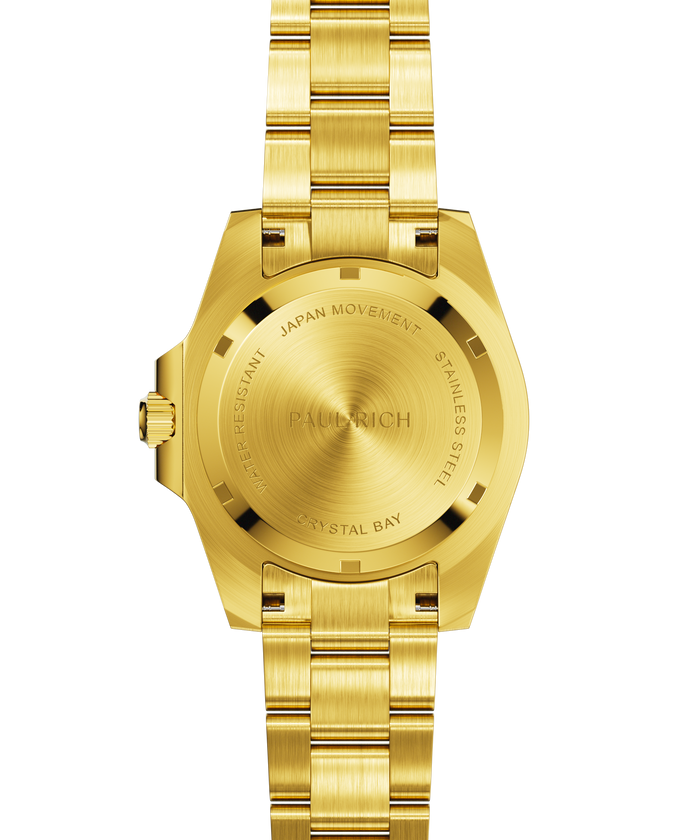 Gold-tone stainless steel watch case back and bracelet shown from the rear, displaying engraved details and brushed metal texture.