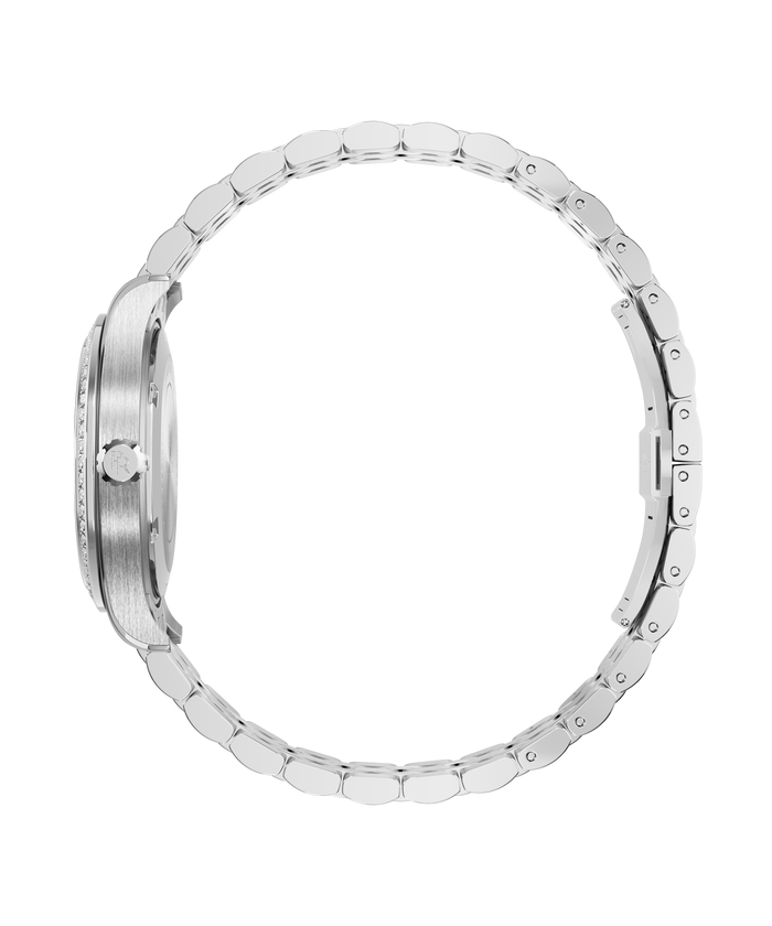 Side view of a silver-tone Paul Rich watch with a brushed case, gem-set bezel, engraved crown, and fully closed rounded link bracelet.