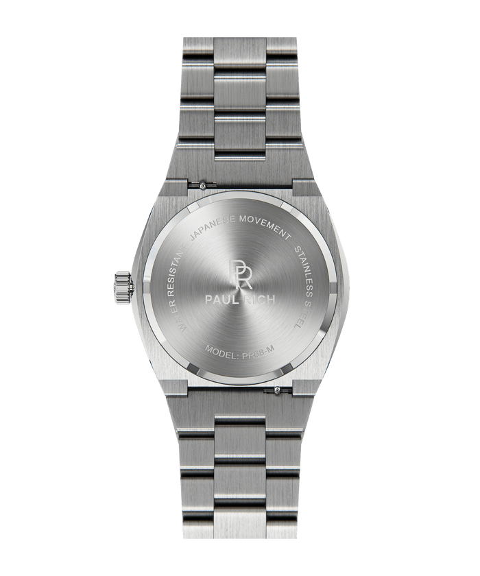 Back of Paul Rich watch with brushed stainless steel case and bracelet, showing engraved PR logo and text including “JAPANESE MOVEMENT” and “MODEL: PR68-M.”