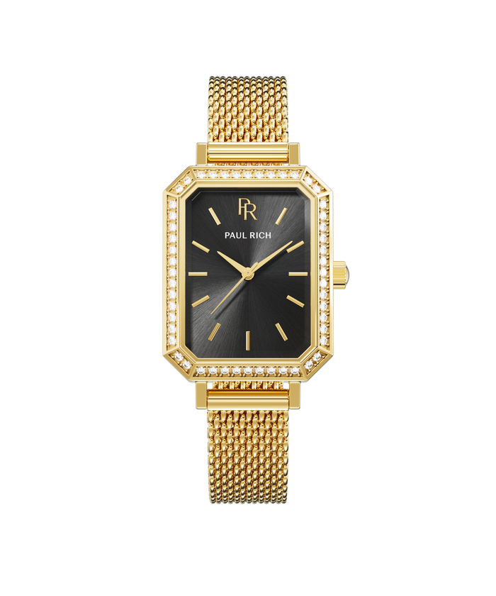 Front view of a gold-tone Paul Rich watch with black sunray dial, gem-set octagonal bezel, and gold mesh strap.