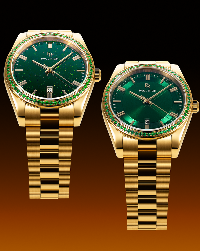 Two gold watches with green dials and green gemstone-set bezels on gold bracelets, one with an aventurine dial and one with a sunray dial, displayed on a dark gradient background.