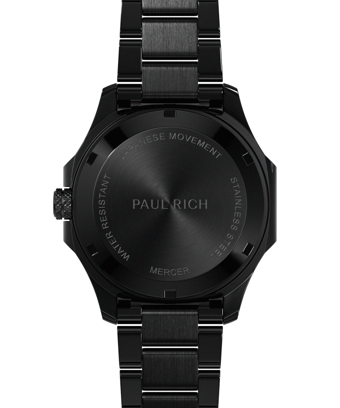 Back view of Paul Rich watch with brushed black caseback engraved with “PAUL RICH,” “MERCER,” “JAPANESE MOVEMENT,” and “STAINLESS STEEL.”