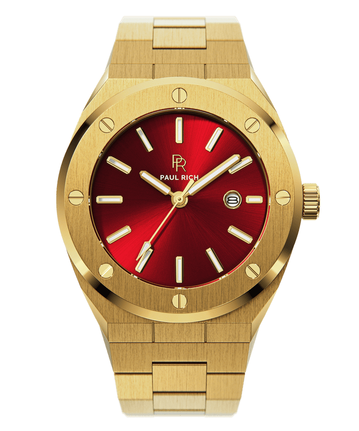 Front view of Paul Rich brushed gold watch with vibrant red sunray dial, gold markers, and date window, on transparent background.